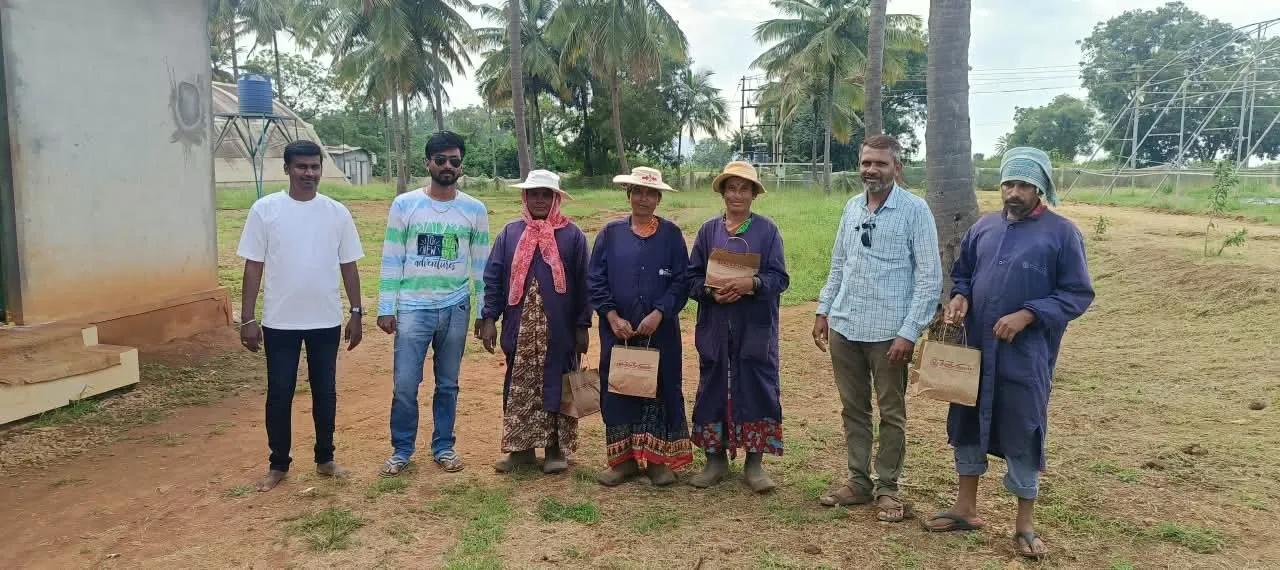 Siddhi Associate field team standing together at a client site