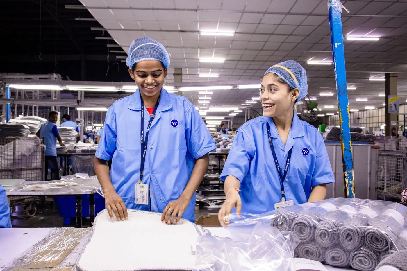 Workers in uniform at an industrial unit